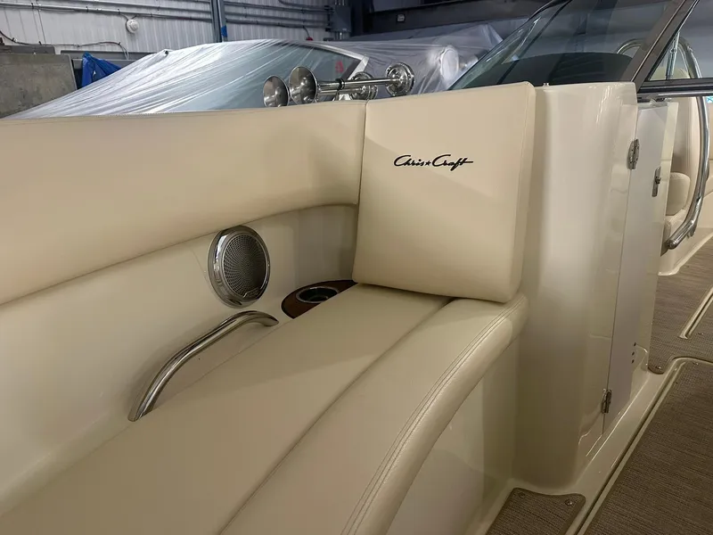 Slide: The Image of 2025 Chris-Craft Launch 27 interior with beige seating and logo detail. - 14