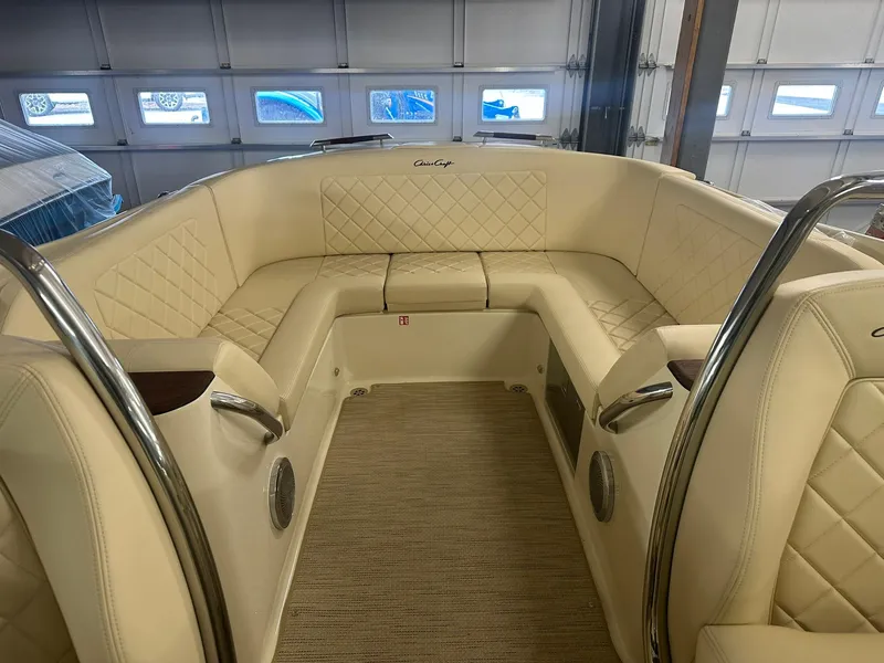 Slide: The Image of 2025 Chris-Craft Launch 27 interior with beige leather seating and elegant design. - 16