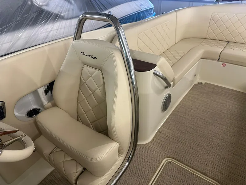 Slide: The Image of Luxurious interior of 2025 Chris-Craft Launch 27 boat with beige leather seating. - 17
