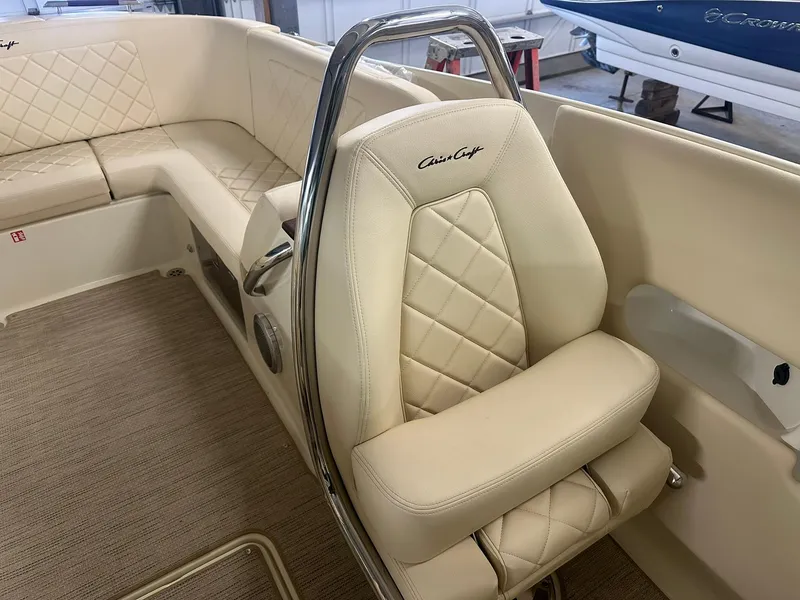Slide: The Image of 2025 Chris-Craft Launch 27 interior with beige quilted seating and elegant design. - 18