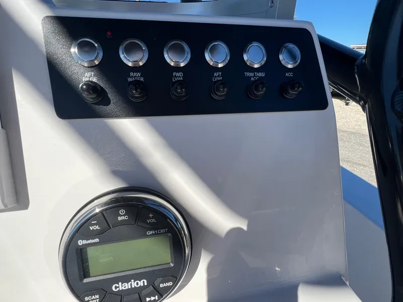 Slide: The Image of Control panel of 2025 Robalo 206 Cayman boat with Clarion audio system. - 15