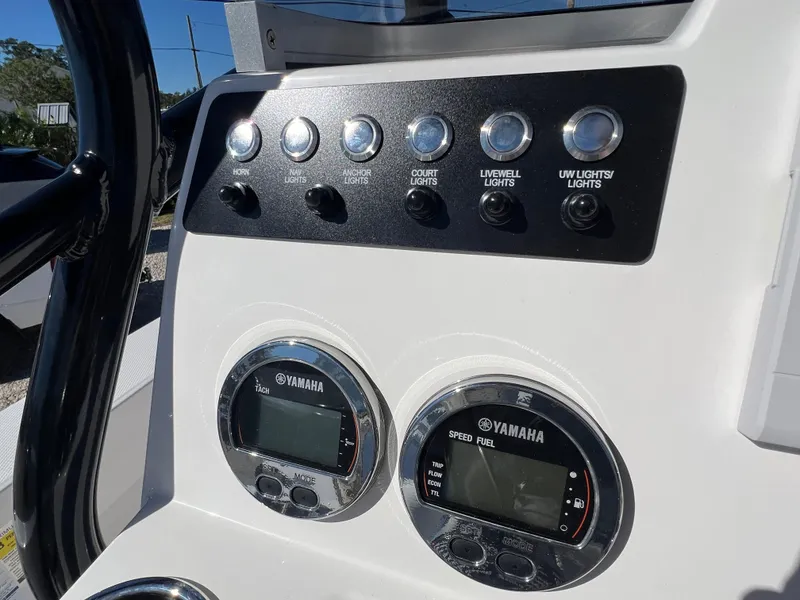 Slide: The Image of Dashboard of 2025 Robalo 206 Cayman boat with Yamaha controls and switches. - 16