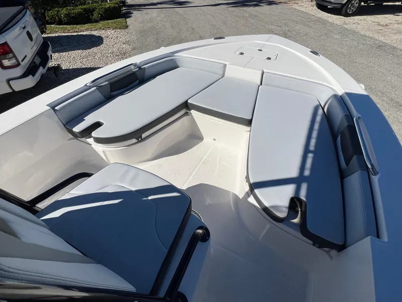 Slide: The Image of 2025 Robalo 206 Cayman boat interior with cushioned seating and sleek design. - 18