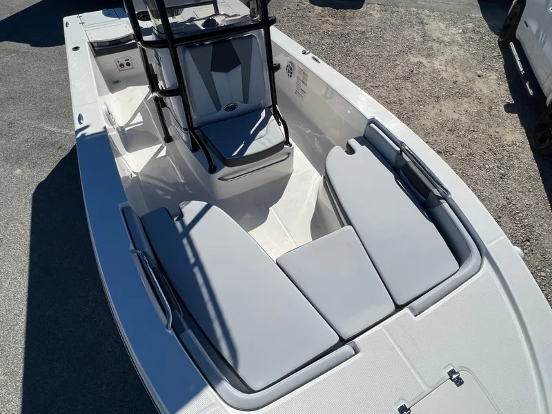 Slide: The Image of 2025 Robalo 206 Cayman boat interior with cushioned seating and console. - 20