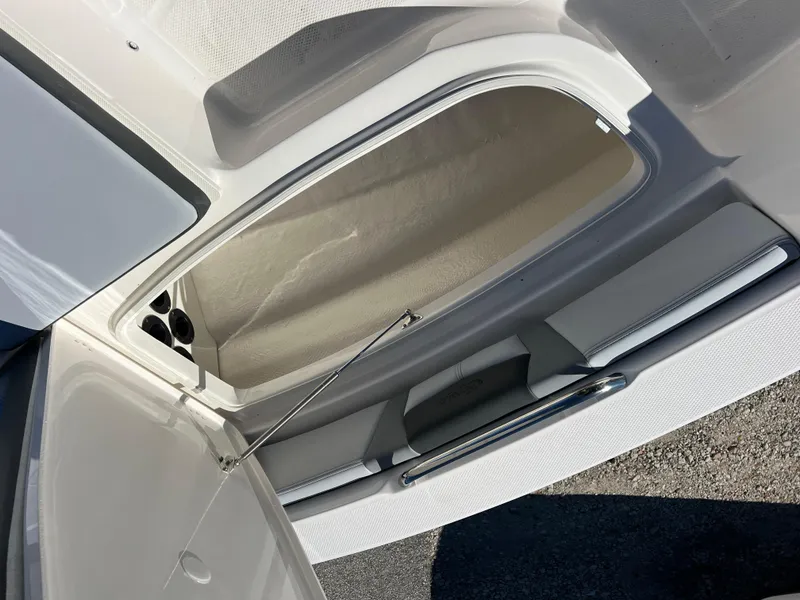 Slide: The Image of Open storage compartment in 2025 Robalo 206 Cayman boat. - 21