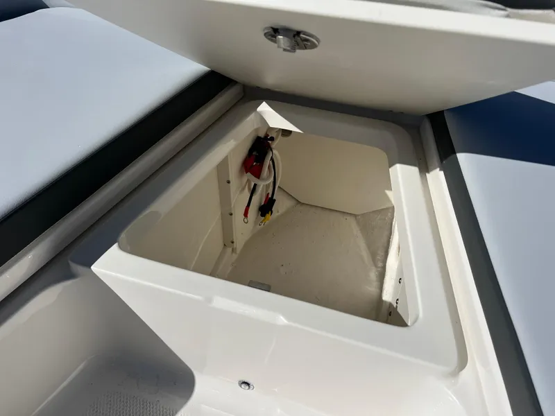 Slide: The Image of Open storage compartment on 2025 Robalo 206 Cayman boat. - 23