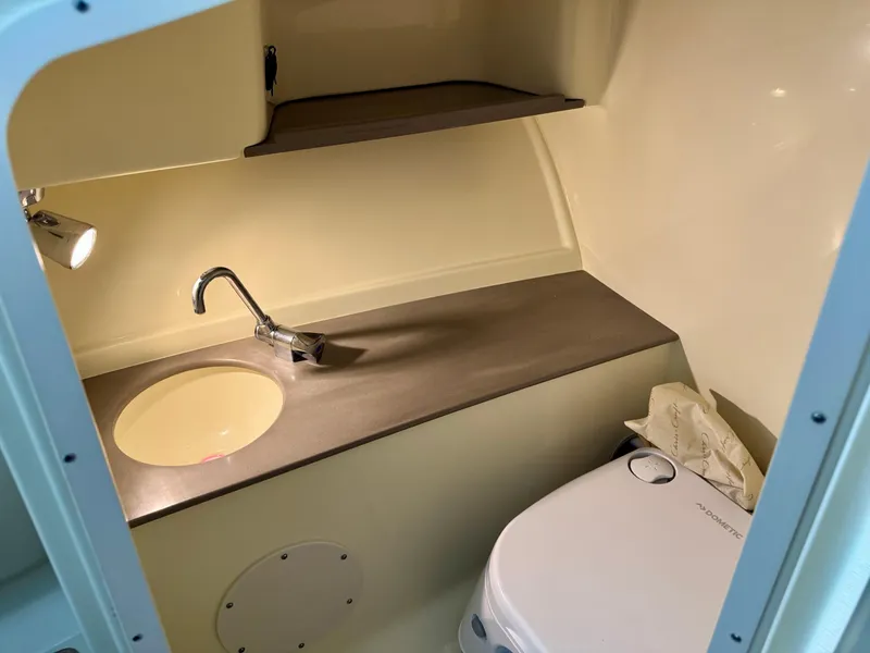 Slide: The Image of 2025 Chris-Craft Launch 27 interior with sink and toilet. - 10
