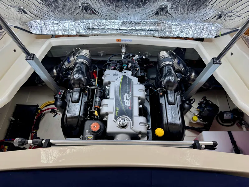 Slide: The Image of Engine compartment of 2025 Chris-Craft Launch 27 boat, showcasing powerful dual engines. - 14