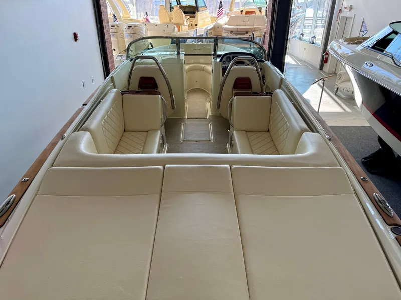 Slide: The Image of 2025 Chris-Craft Launch 27 boat interior with beige seating and sleek design. - 4