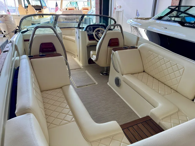 Slide: The Image of 2025 Chris-Craft Launch 27 boat interior with luxurious cream seating and elegant design. - 5
