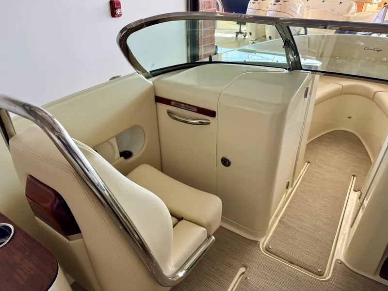 Slide: The Image of 2025 Chris-Craft Launch 27 interior with beige seating and sleek design. - 9