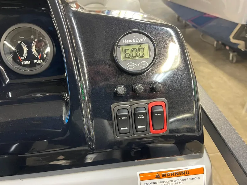 Slide: The Image of Control panel of 2025 JC Spirit 247TT Sport boat with gauges and switches. - 13