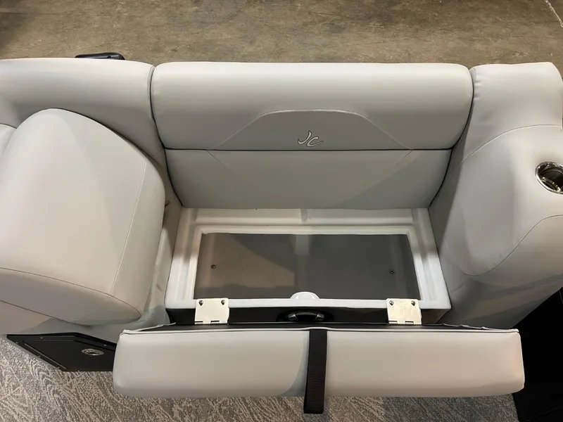 Slide: The Image of 2025 JC Spirit 247TT Sport boat seat with storage compartment open. - 19