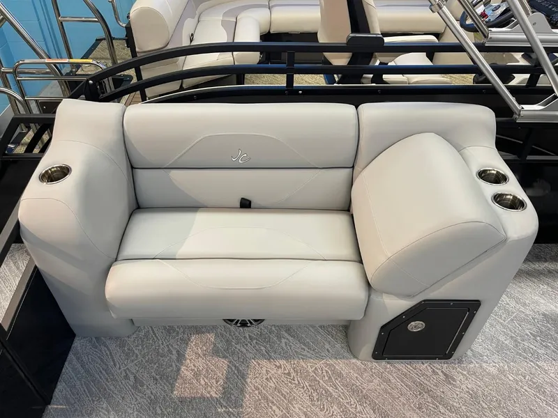 Slide: The Image of Luxury seating on 2025 JC Spirit 247TT Sport boat with cup holders and sleek design. - 22