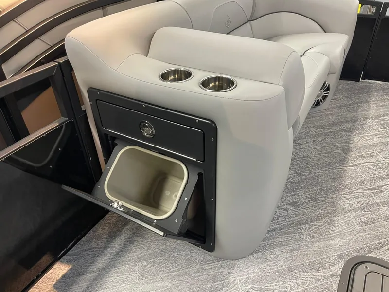 Slide: The Image of 2025 JC Spirit 247TT Sport boat interior with built-in cooler and cup holders. - 25