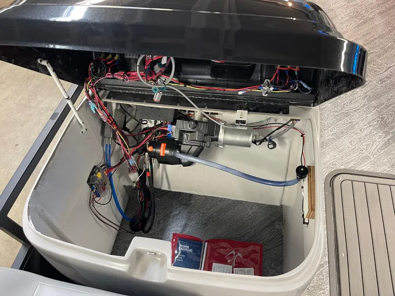 Slide: The Image of Open compartment of 2025 JC Spirit 247TT Sport showing wiring and components. - 27