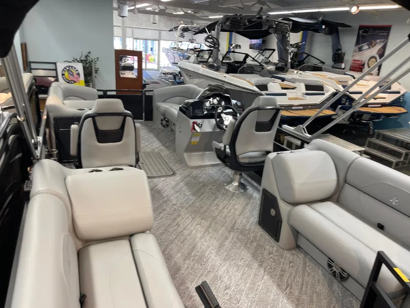 Slide: The Image of 2025 JC Spirit 247TT Sport boat interior with modern seating and steering console. - 29