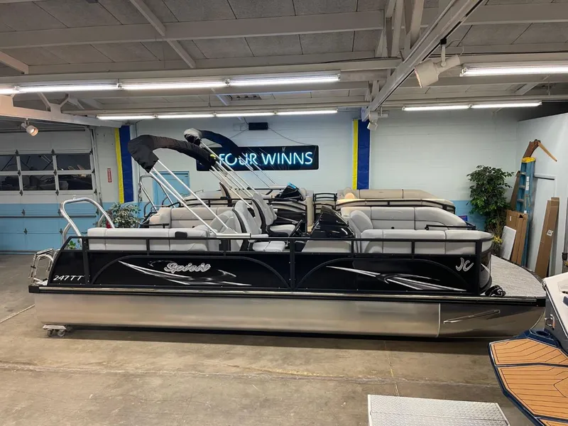 Slide: The Image of 2025 JC Spirit 247TT Sport pontoon boat in showroom setting. - 3