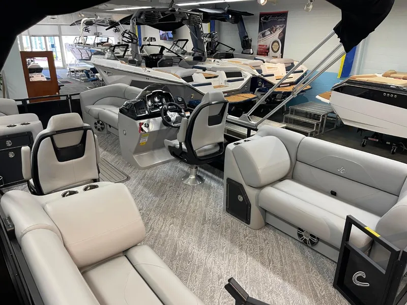 Slide: The Image of Showroom display of 2025 JC Spirit 247TT Sport pontoon boats with luxurious interiors. - 38