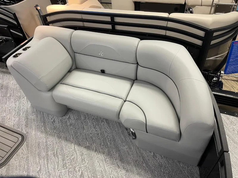 Slide: The Image of 2025 JC Spirit 247TT Sport boat with luxurious gray seating and modern design. - 5