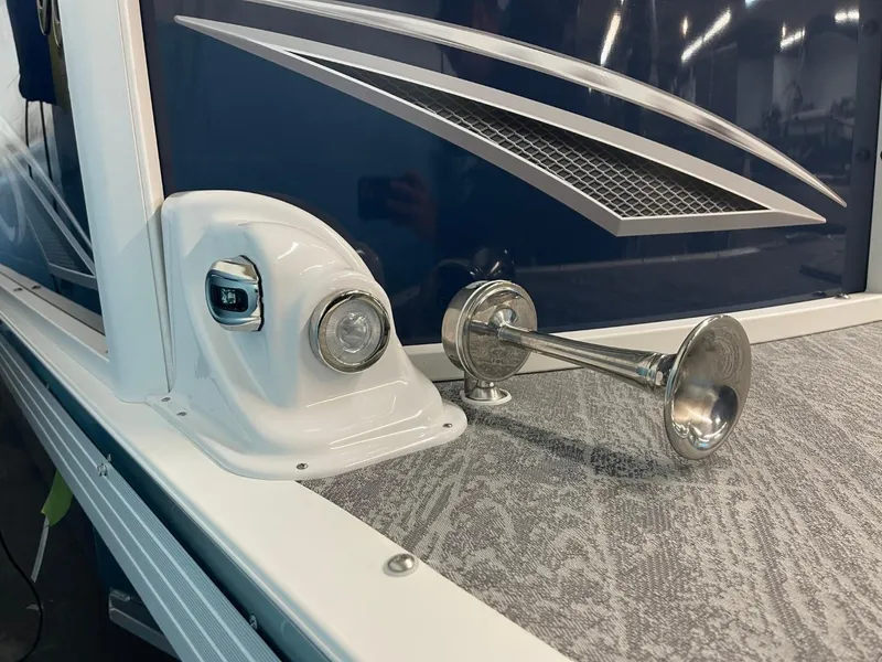 Slide: The Image of 2025 JC Swingback 25 TT boat detail with horn and light on deck. - 16
