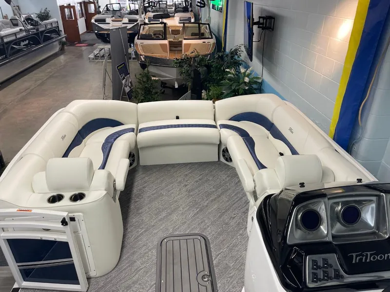 Slide: The Image of 2025 JC Swingback 25 TT pontoon boat interior with plush seating and modern design. - 18