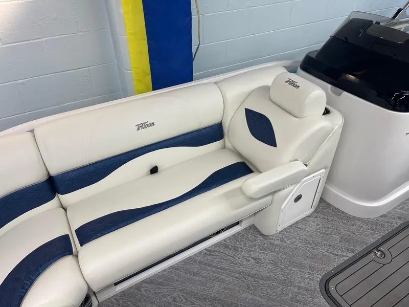 Slide: The Image of Luxurious seating on 2025 JC Swingback 25 TT boat with blue and white upholstery. - 21