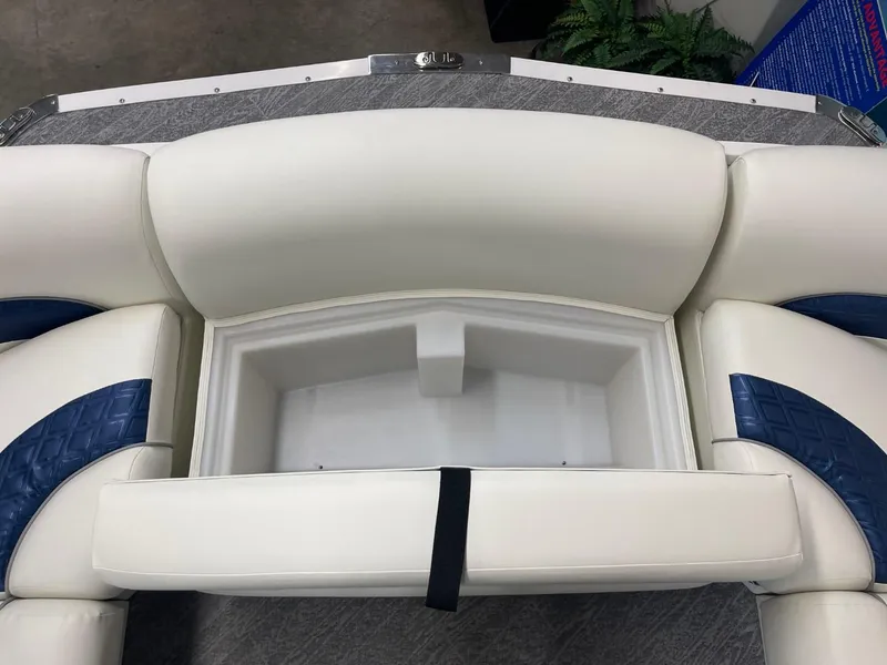 Slide: The Image of 2025 JC Swingback 25 TT boat seating with storage compartment, featuring white and blue upholstery. - 24