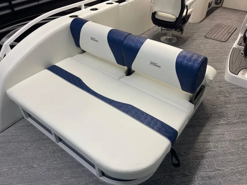 Slide: The Image of 2025 JC Swingback 25 TT boat interior with blue and white seating. - 31