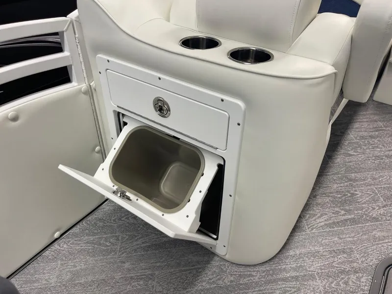 Slide: The Image of 2025 JC Swingback 25 TT boat interior with storage compartment and cup holders. - 37