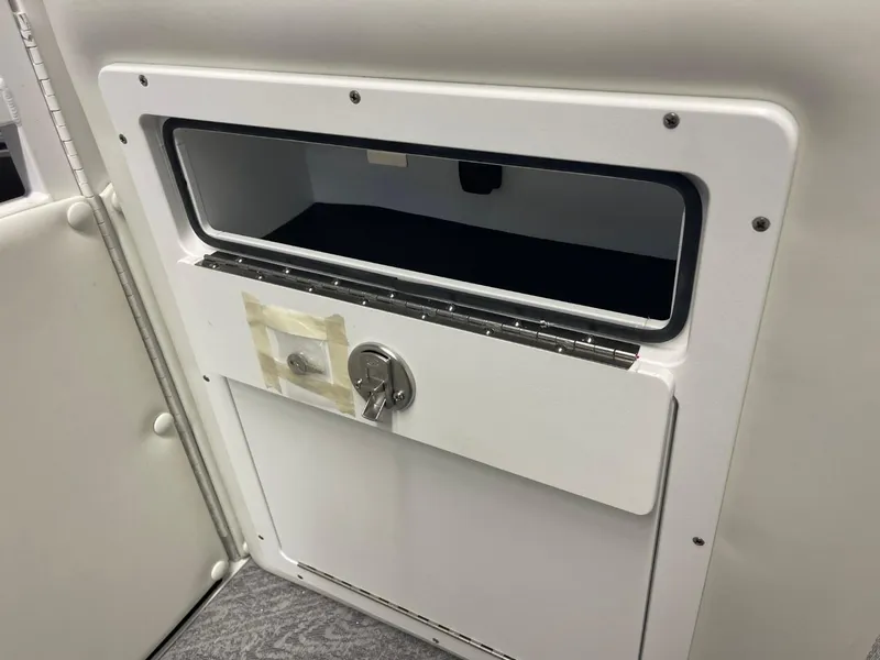 Slide: The Image of Storage compartment in 2025 JC Swingback 25 TT boat interior. - 38