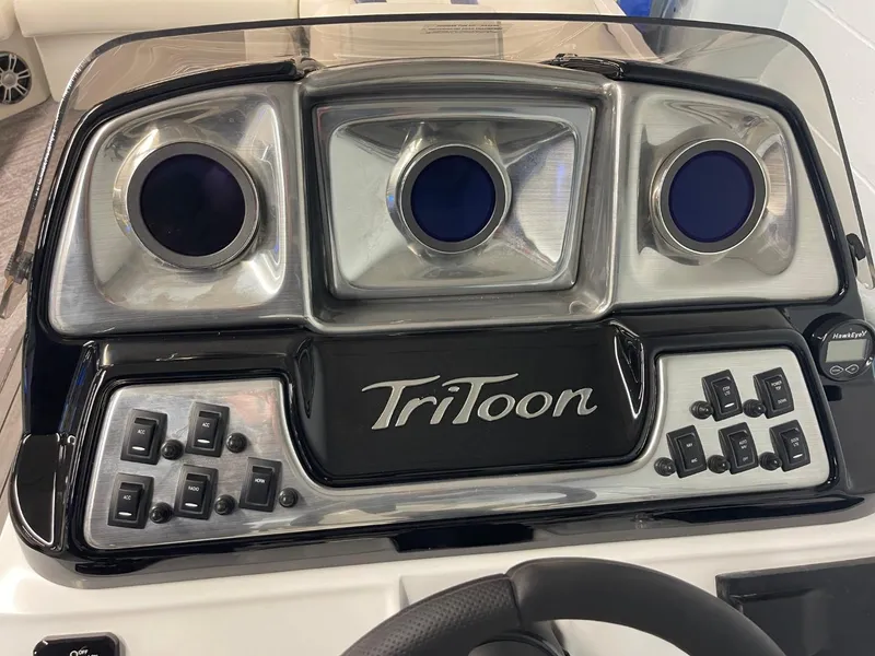 Slide: The Image of Dashboard of 2025 JC Swingback 25 TT pontoon boat with TriToon branding. - 41