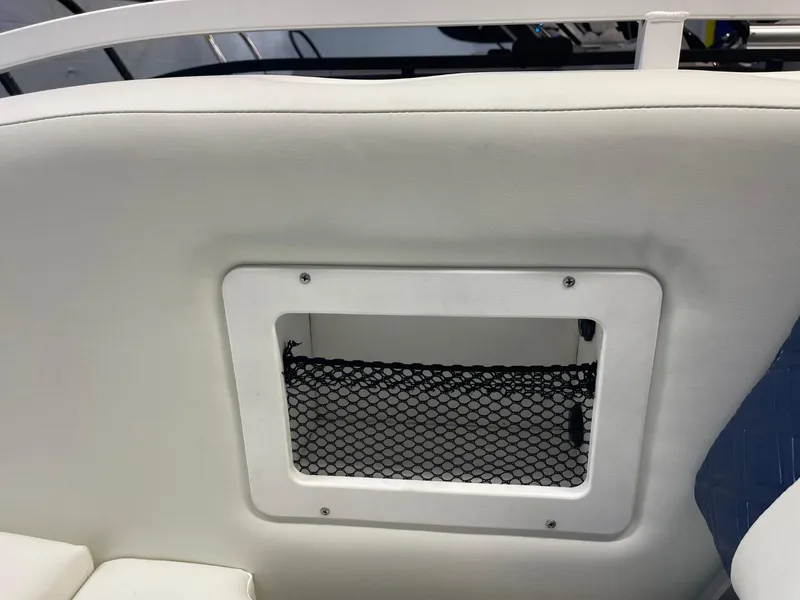Slide: The Image of 2025 JC Swingback 25 TT boat seat with storage compartment and netting. - 45