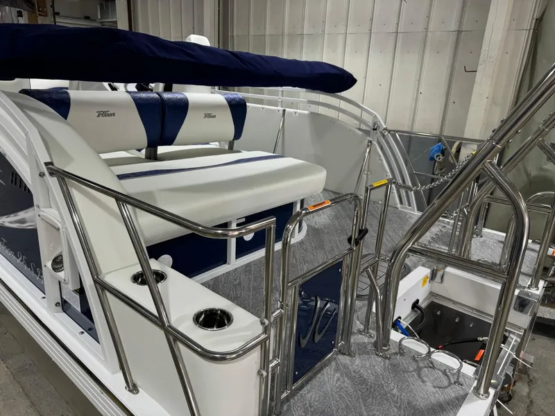 Slide: The Image of 2025 JC Swingback 25 TT boat interior with plush seating and stainless steel railings. - 7