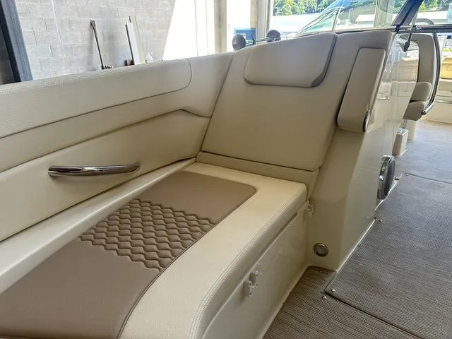 Slide: The Image of Luxurious seating in 2025 Chris-Craft Launch 28 GT boat, featuring elegant beige upholstery. - 13