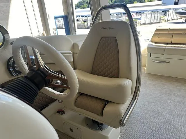 Slide: The Image of 2025 Chris-Craft Launch 28 GT interior with luxurious seating and steering wheel. - 15