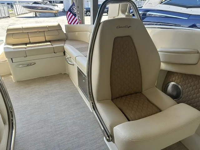 Slide: The Image of 2025 Chris-Craft Launch 28 GT interior with luxurious seating and American flag detail. - 16