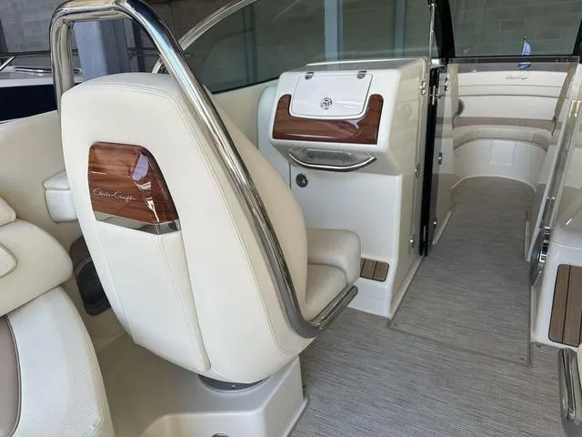 Slide: The Image of Luxurious interior of 2025 Chris-Craft Launch 28 GT boat with elegant seating and wood accents. - 7