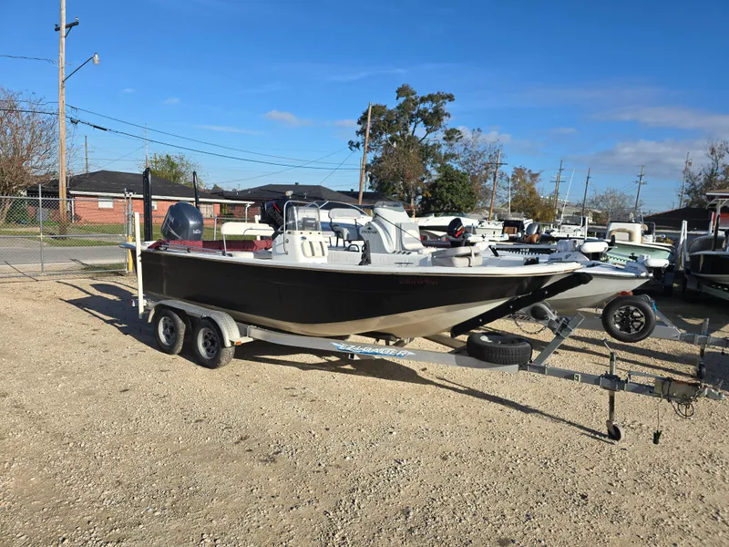 Slide: The Image of 2011 Carolina Skiff 218 DLV boat on trailer in outdoor lot. - 1