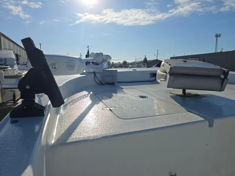 Slide: The Image of 2011 Carolina Skiff 218 DLV boat deck under sunny sky. - 12