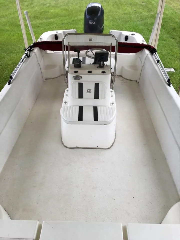 Slide: The Image of 2011 Carolina Skiff 218 DLV boat interior with center console and seating. - 13