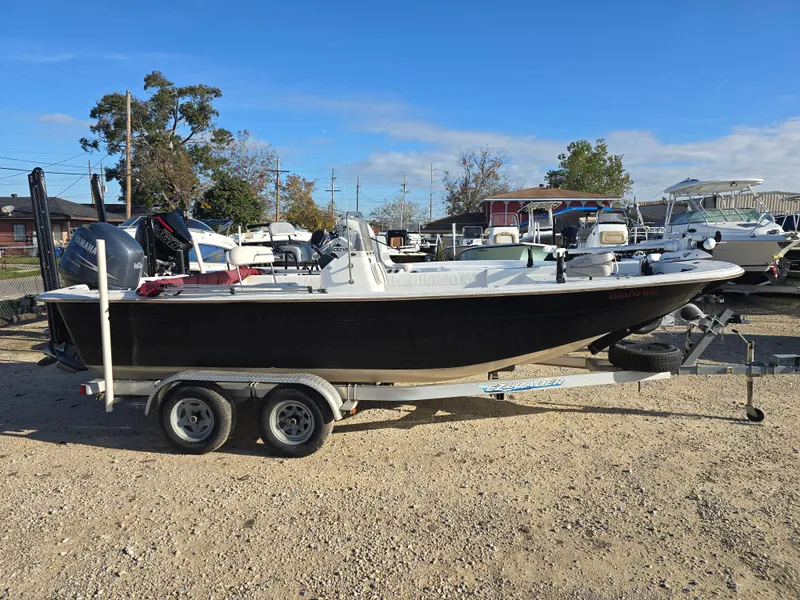 Slide: The Image of 2011 Carolina Skiff 218 DLV boat on trailer in outdoor lot. - 3