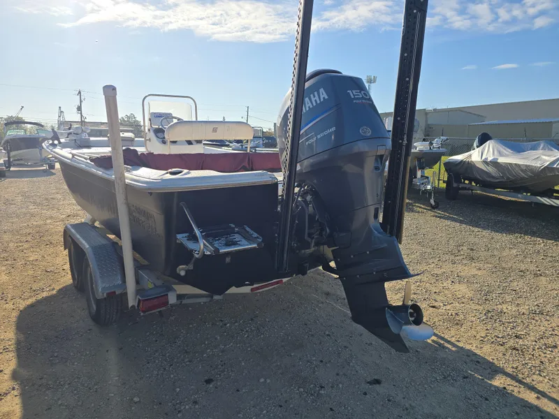 Slide: The Image of 2011 Carolina Skiff 218 DLV boat with Yamaha outboard motor on trailer. - 5