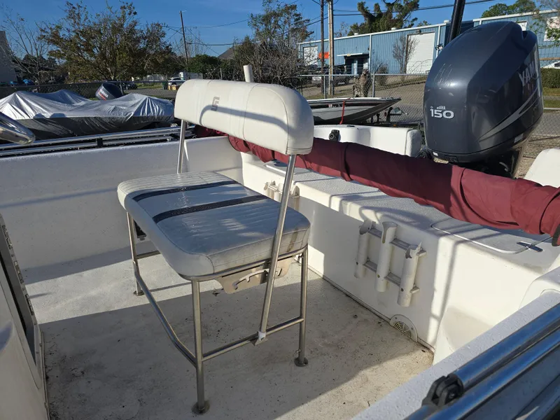 Slide: The Image of 2011 Carolina Skiff 218 DLV boat interior with Yamaha 150 outboard motor. - 7