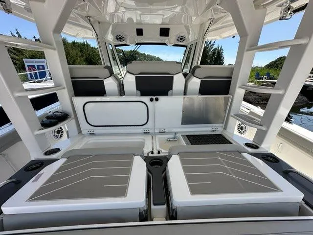 Slide: The Image of Interior of 2021 Pursuit S 428 Sport boat with seating and storage compartments. - 29