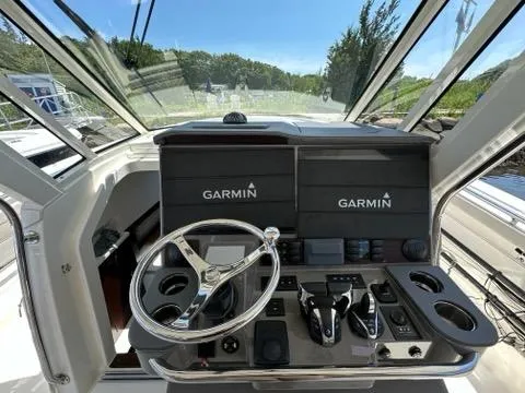 Slide: The Image of 2021 Pursuit S 428 Sport boat helm with Garmin navigation system. - 31