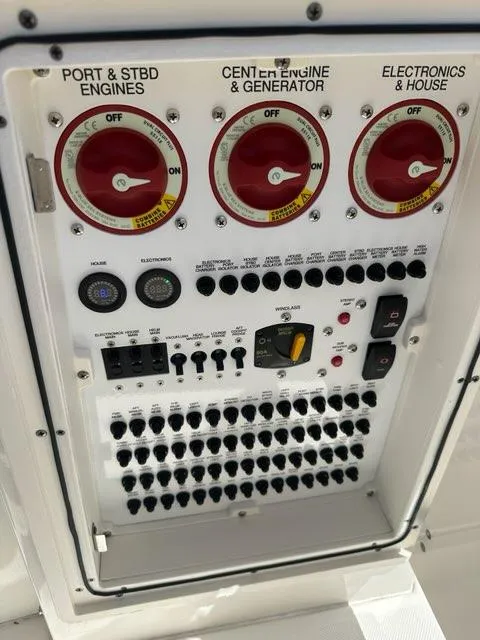 Slide: The Image of Control panel of 2021 Pursuit S 428 Sport boat with engine and electronics switches. - 41