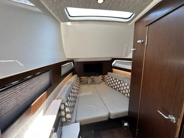 Slide: The Image of Luxurious interior of 2021 Pursuit S 428 Sport boat with modern seating and skylight. - 44