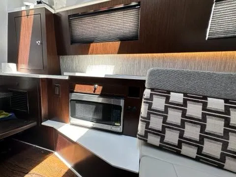 Slide: The Image of 2021 Pursuit S 428 Sport interior with modern kitchen and seating area. - 49