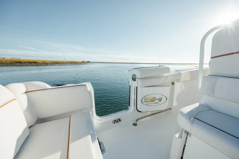 Slide: The Image of 2021 Sea Hunt Ultra 255 SE boat interior with scenic water view. - 12